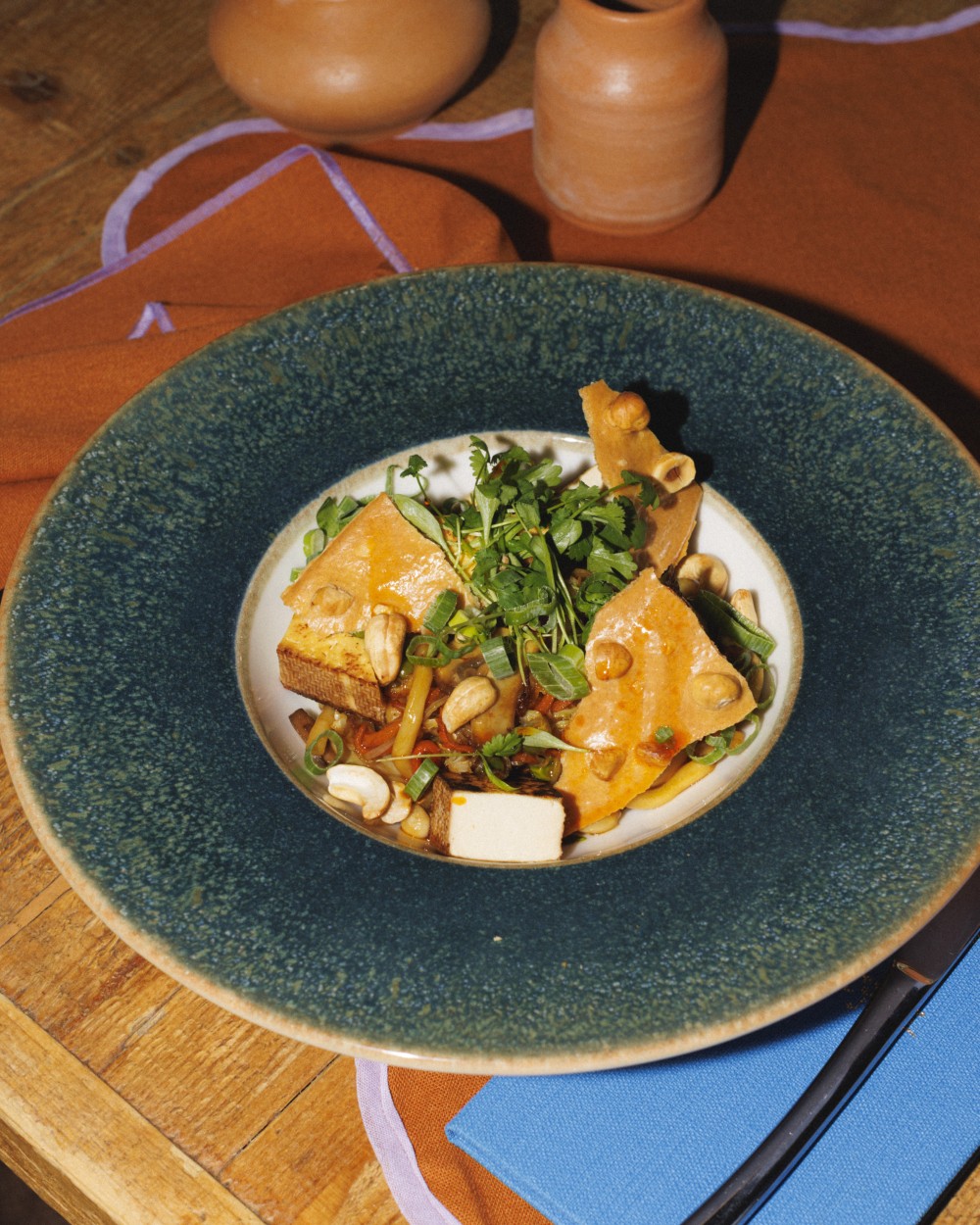 Soy-glazed udon noodles with stir-fried vegetables and cashew nuts
